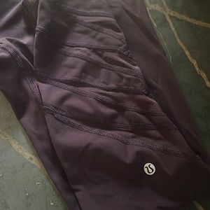 Lululemon dark purple leggings w/ sheer design on lower part of leggings. Size 8